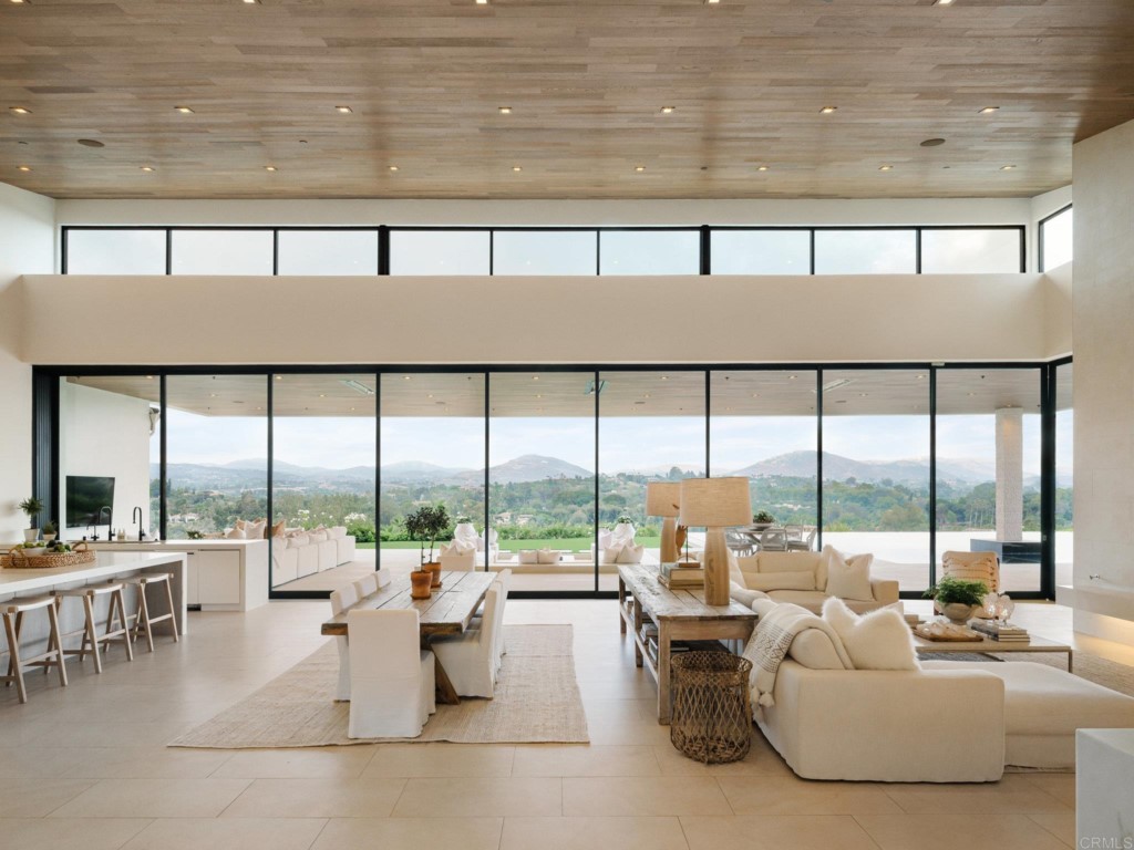 5516 La Crescenta Road Rancho Santa Fe, CA 92067 - Photo 21 of 68 a living room with furniture and a large window