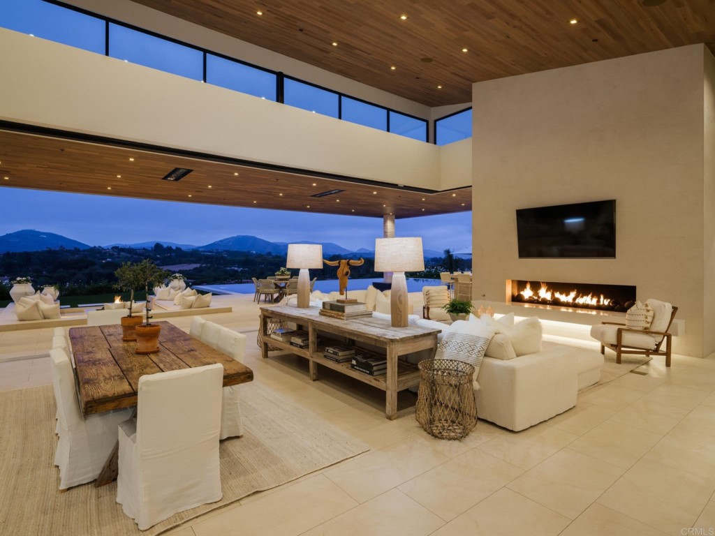 5516 La Crescenta Road Rancho Santa Fe, CA 92067 - Photo 23 of 68 a living room with furniture and a flat screen tv
