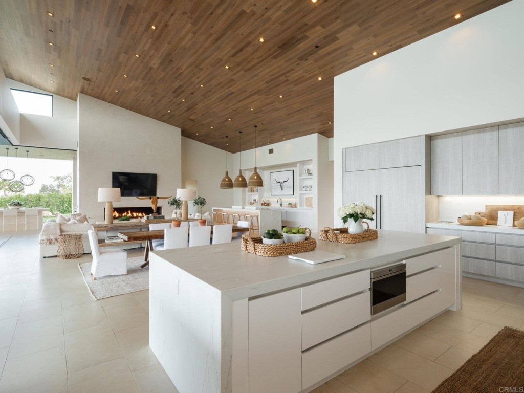 5516 La Crescenta Road Rancho Santa Fe, CA 92067 - Photo 28 of 68 a kitchen with stainless steel appliances kitchen island sink stove and cabinets