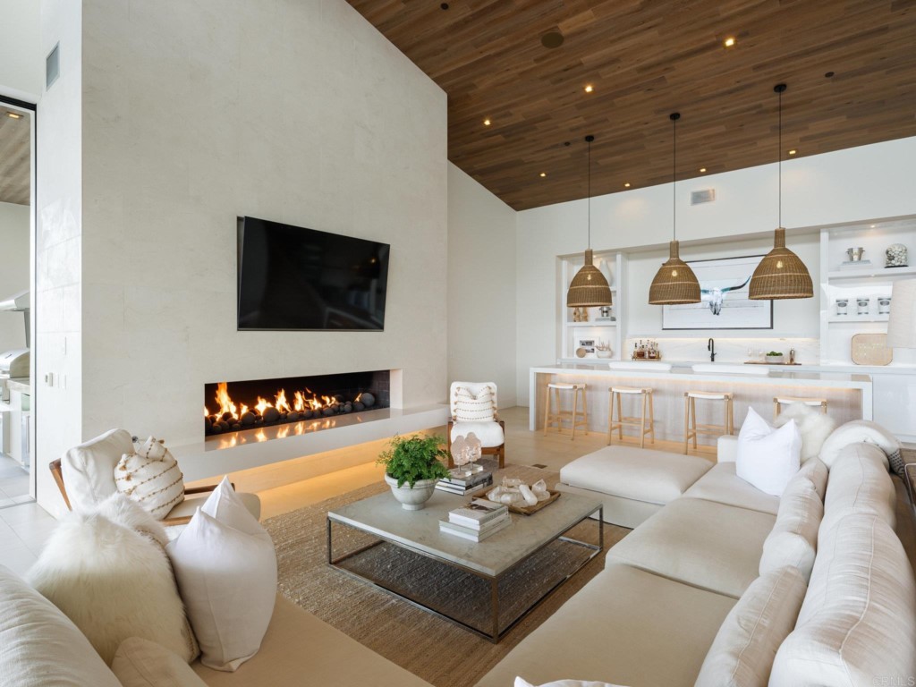 5516 La Crescenta Road Rancho Santa Fe, CA 92067 - Photo 31 of 68 a living room with furniture and a flat screen tv