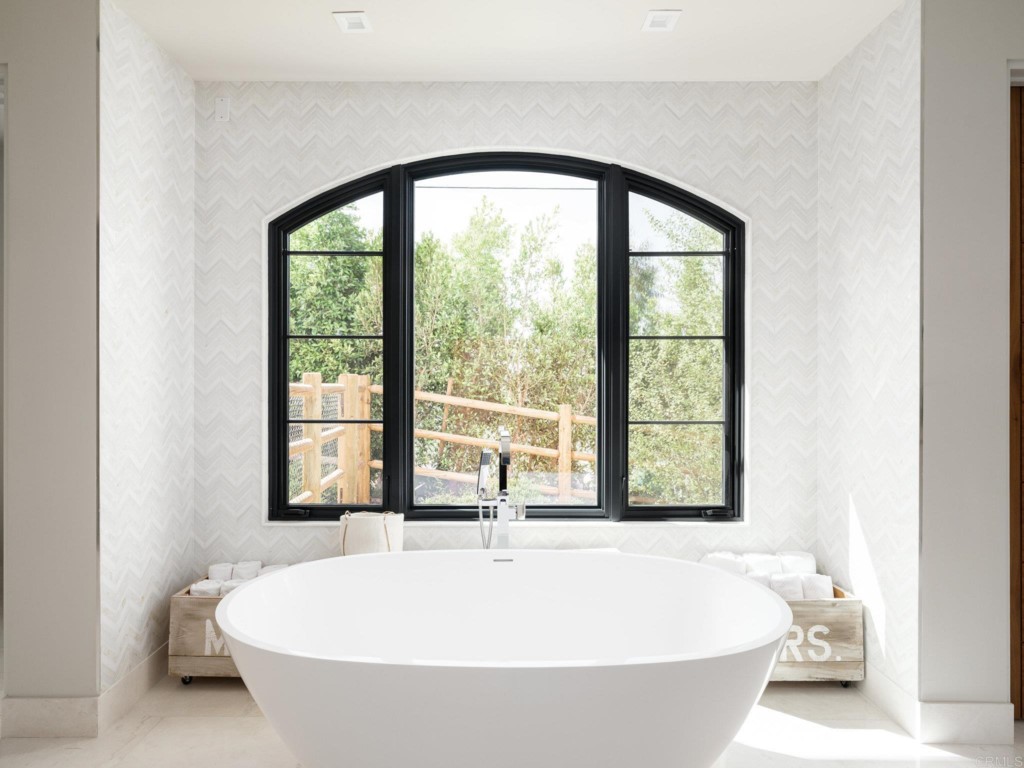 5516 La Crescenta Road Rancho Santa Fe, CA 92067 - Photo 41 of 68 a bathroom with a bathtub and window