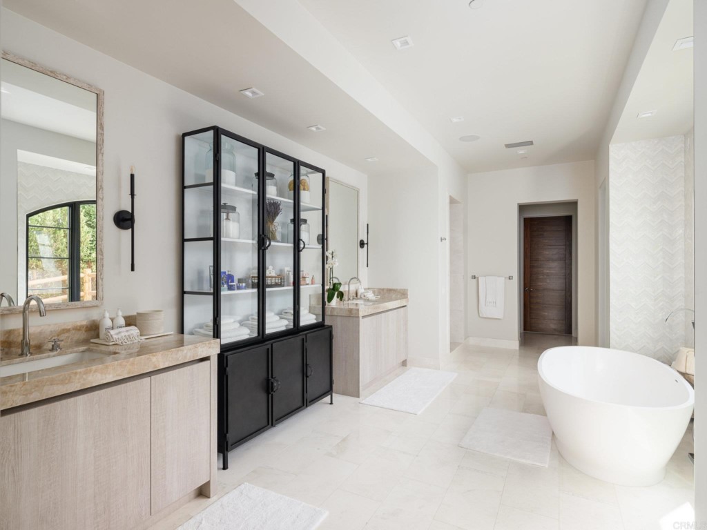 5516 La Crescenta Road Rancho Santa Fe, CA 92067 - Photo 42 of 68 a bathroom with a double vanity sink toilet and shower