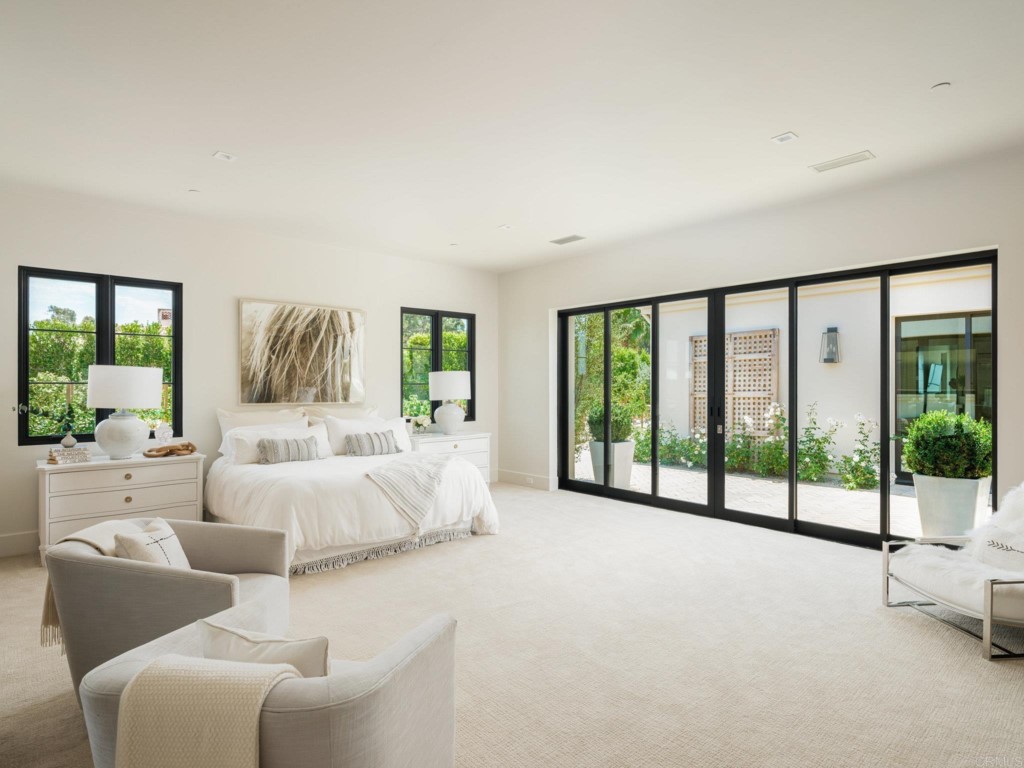 5516 La Crescenta Road Rancho Santa Fe, CA 92067 - Photo 43 of 68 a spacious bedroom with a large bed and a large window