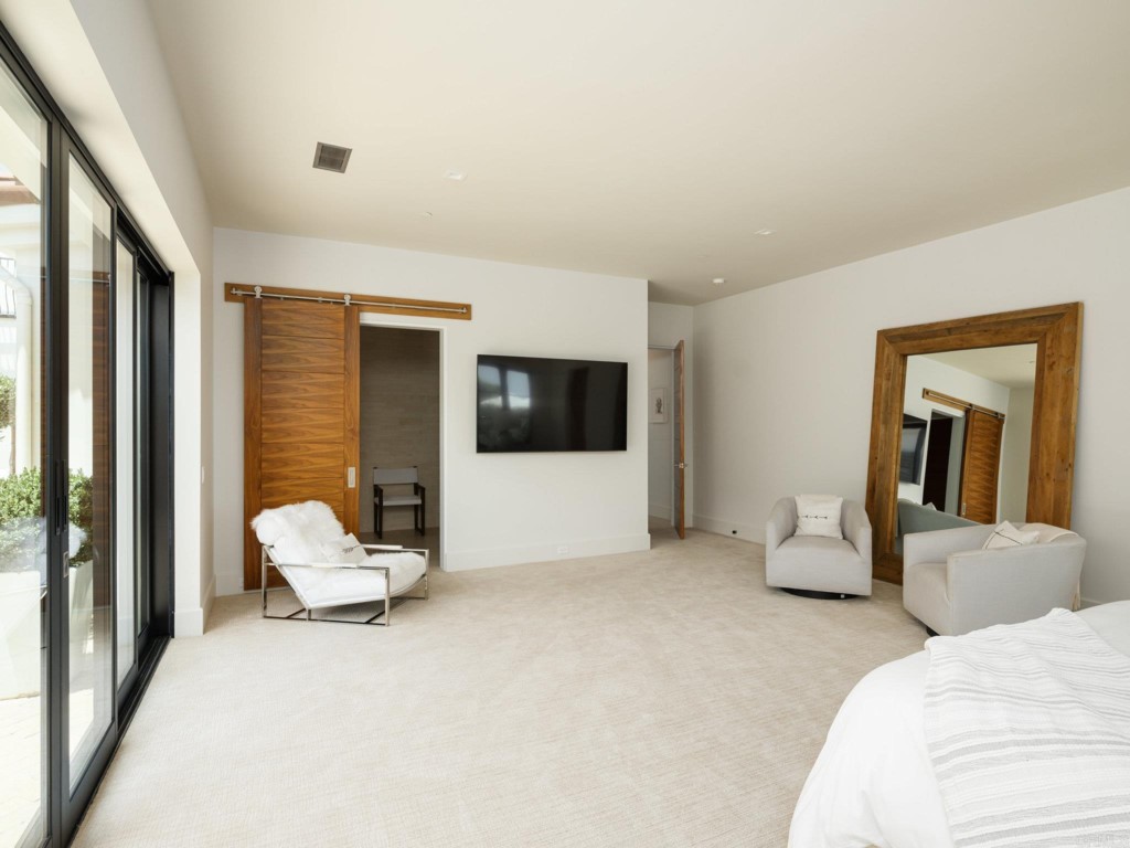 5516 La Crescenta Road Rancho Santa Fe, CA 92067 - Photo 45 of 68 a bedroom with furniture and large windows