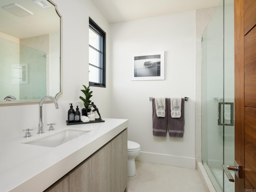 5516 La Crescenta Road Rancho Santa Fe, CA 92067 - Photo 48 of 68 a bathroom with a sink toilet and shower