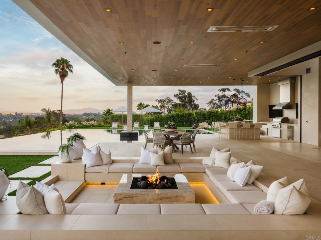 5516 La Crescenta Road Rancho Santa Fe, CA 92067 - Photo 7 of 68 a living room with furniture a chandelier