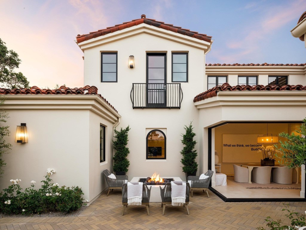5516 La Crescenta Road Rancho Santa Fe, CA 92067 - Photo 10 of 68 a view of a white house with many windows and potted plants