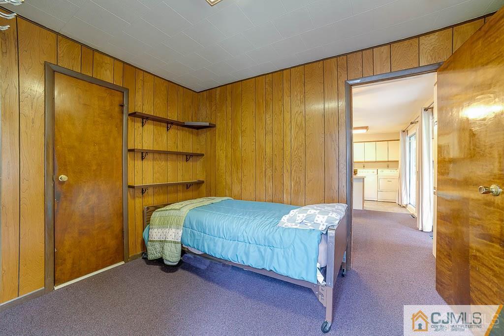 9 Pyne Road Kendall Park, NJ 08824 - Photo 7 of 10 a bedroom with a bed and a table in it
