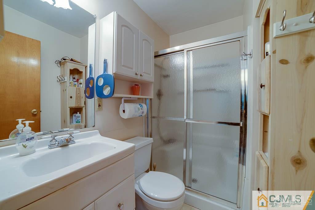 9 Pyne Road Kendall Park, NJ 08824 - Photo 9 of 10 a bathroom with a sink toilet and shower