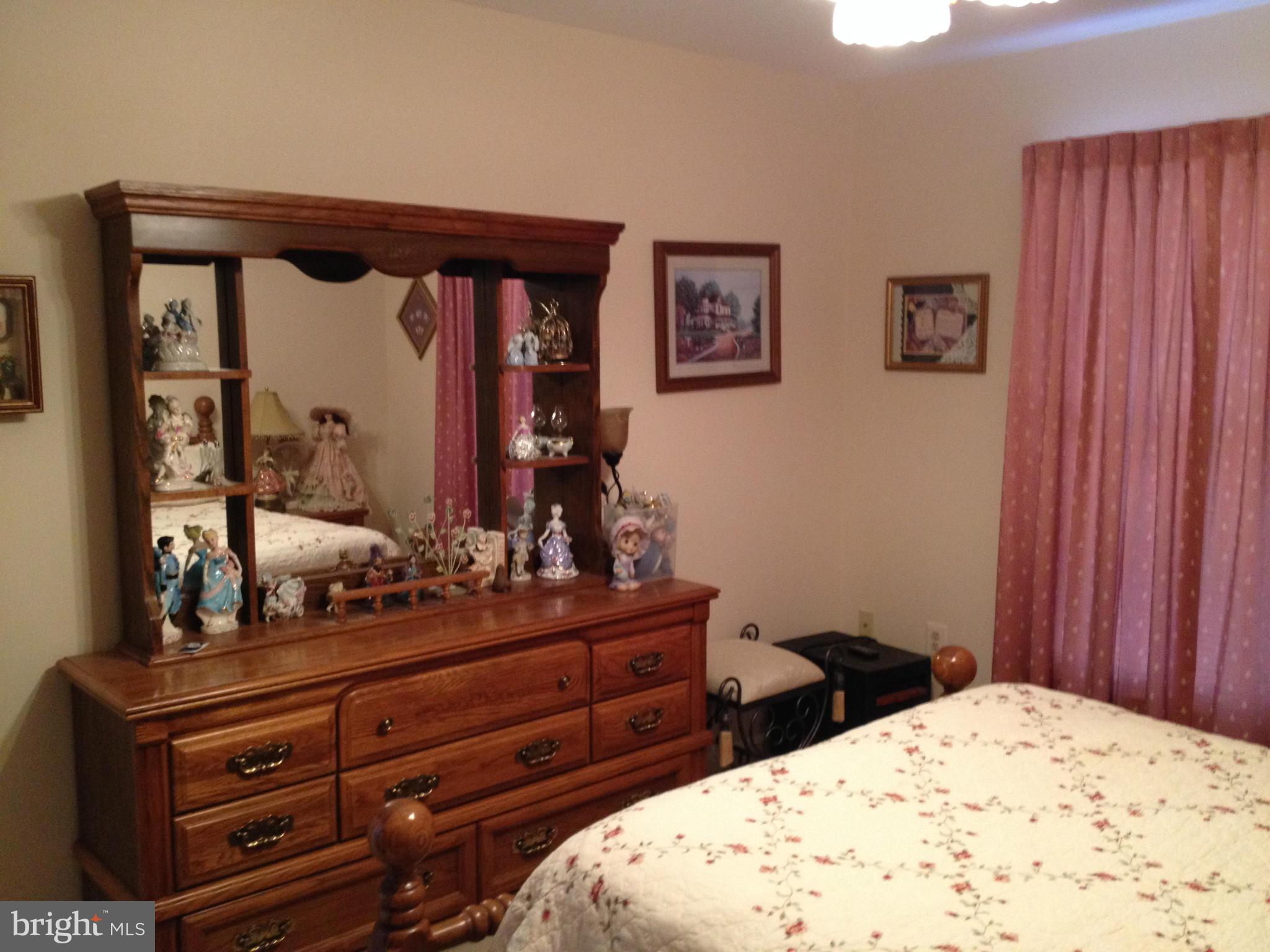 7244 Wilson Road Marshall, VA 20115 - Photo 12 of 30 a bedroom with a bed and a dresser