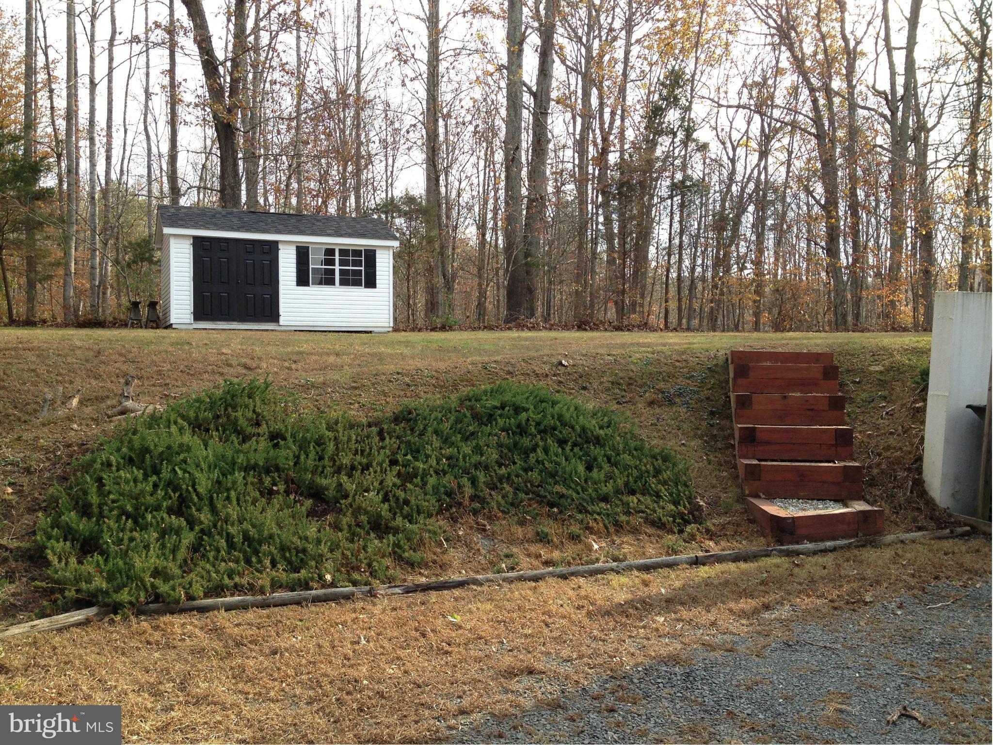 7244 Wilson Road Marshall, VA 20115 - Photo 22 of 30 a view of a house with backyard and trees
