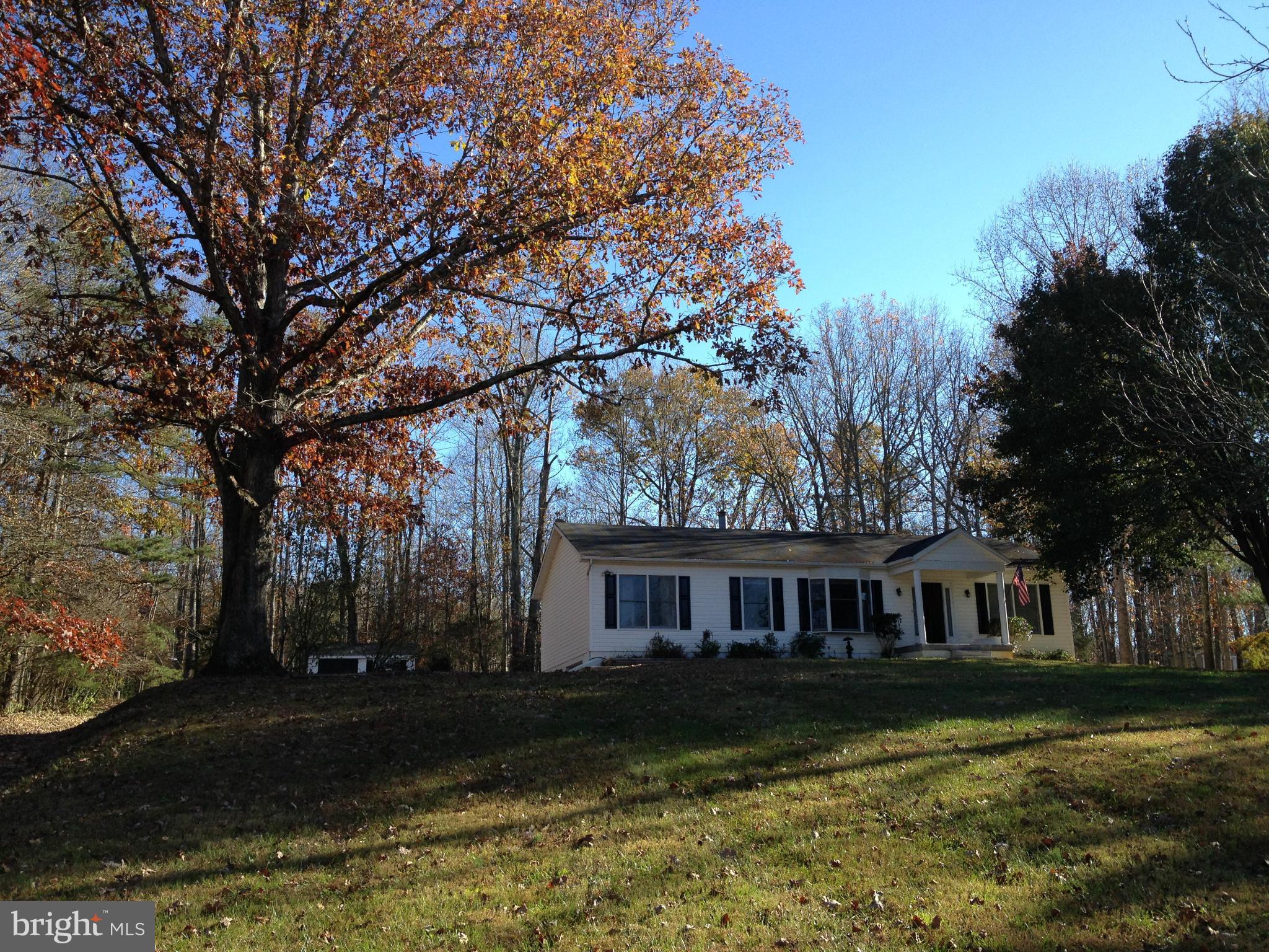 7244 Wilson Road Marshall, VA 20115 - Photo 29 of 30 a front view of a house with a yard and trees