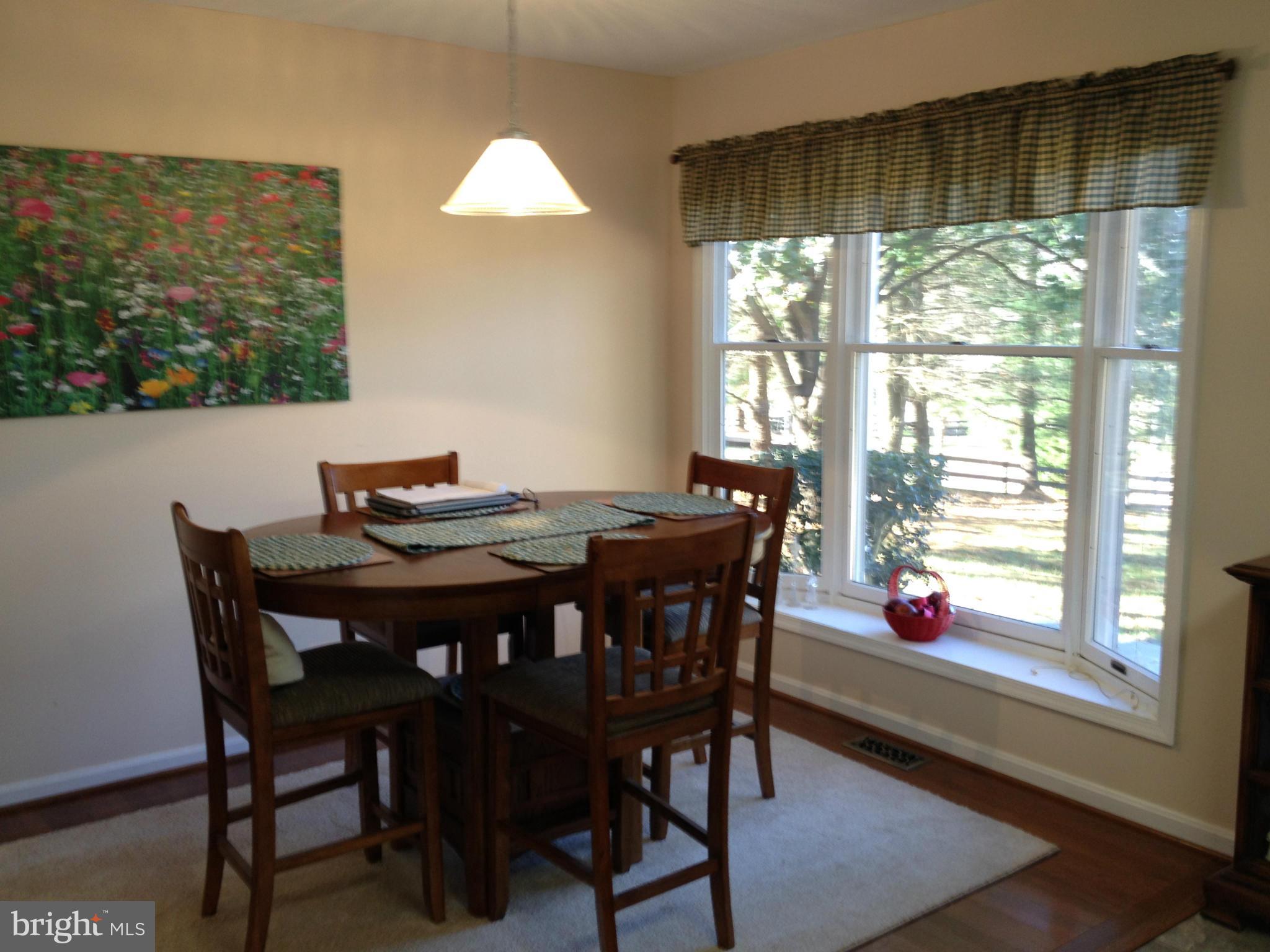 7244 Wilson Road Marshall, VA 20115 - Photo 6 of 30 a view of a dining room with furniture and window