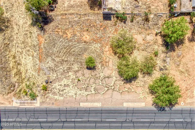 a view of a yard from a balcony