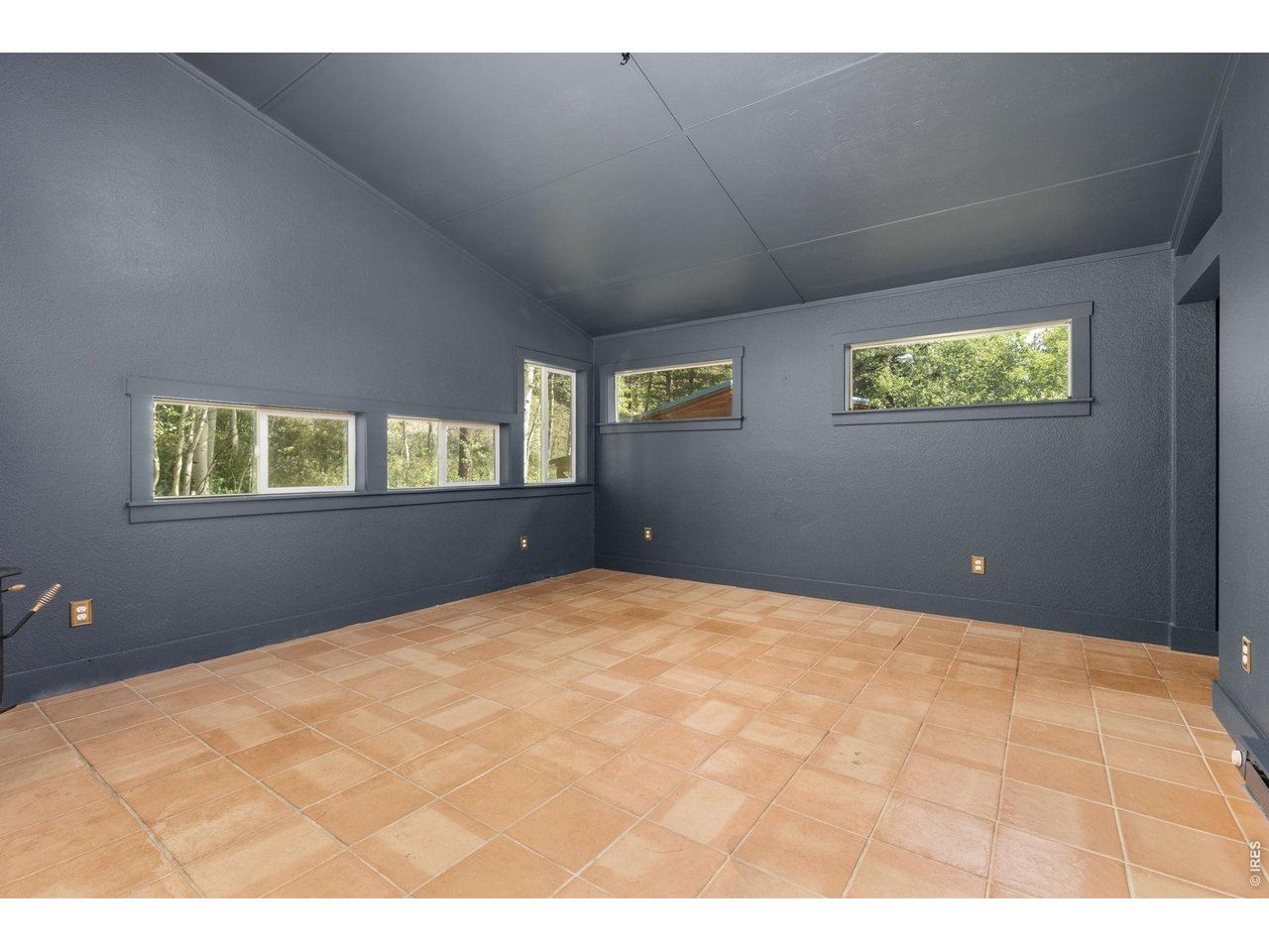 665 Lower Travis Gulch Road Black Hawk, CO 80422 - Photo 21 of 47 Tile flooring with numerous windows for great natural light