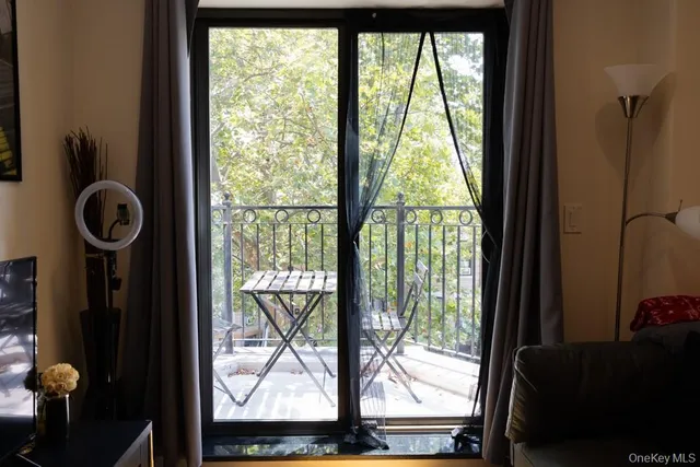 a bedroom with a bed and a lamp