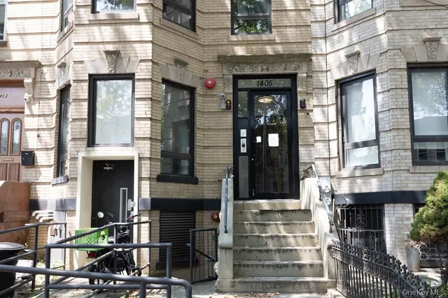 a front view of a building with glass windows