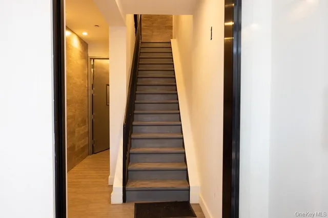a view of a hallway with stairs
