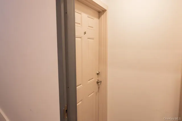 a view of a livingroom with furniture and a flat screen tv