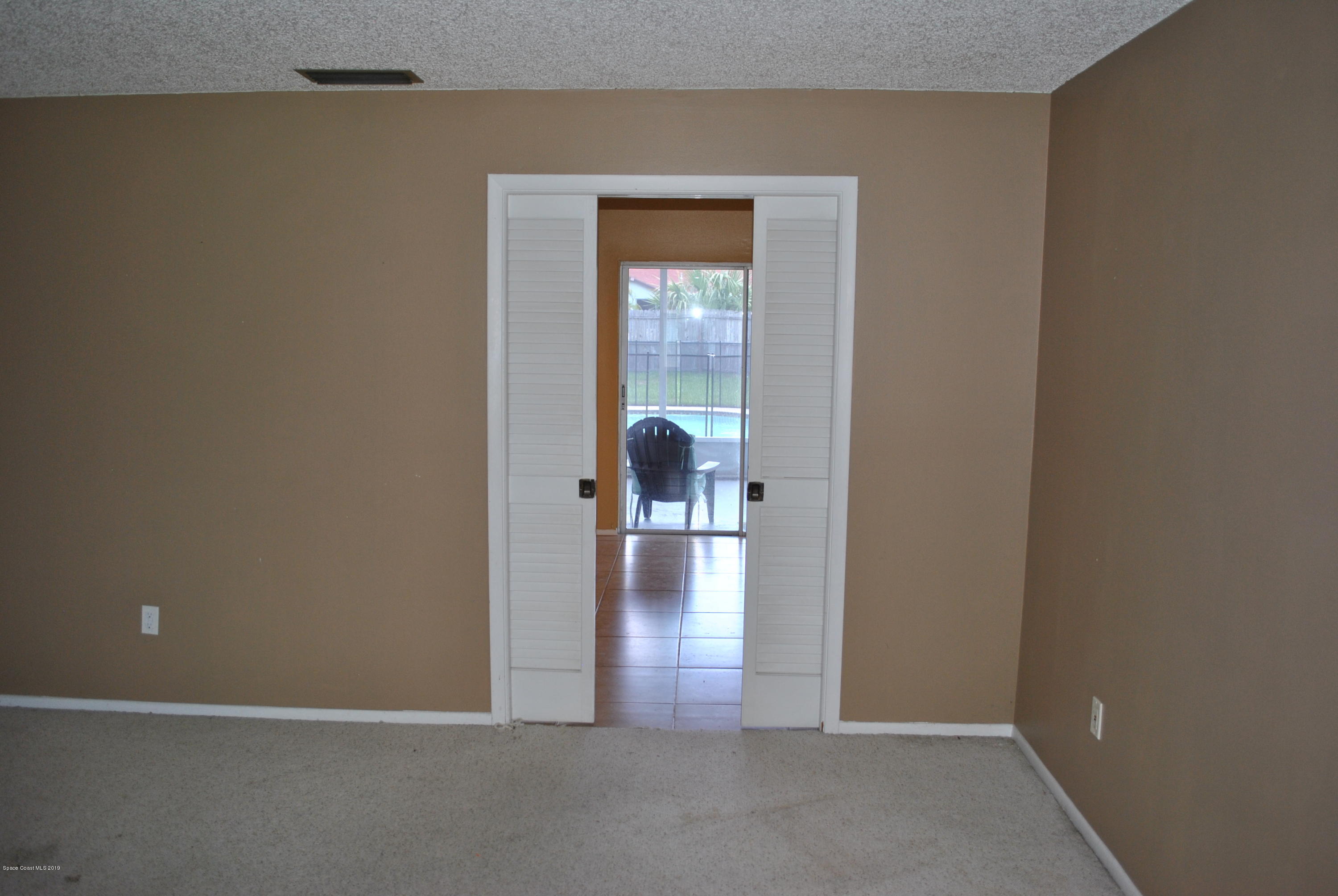 1167 Cotton Road Northeast Palm Bay, FL 32905 - Photo 11 of 34 a view of livingroom with wooden floor