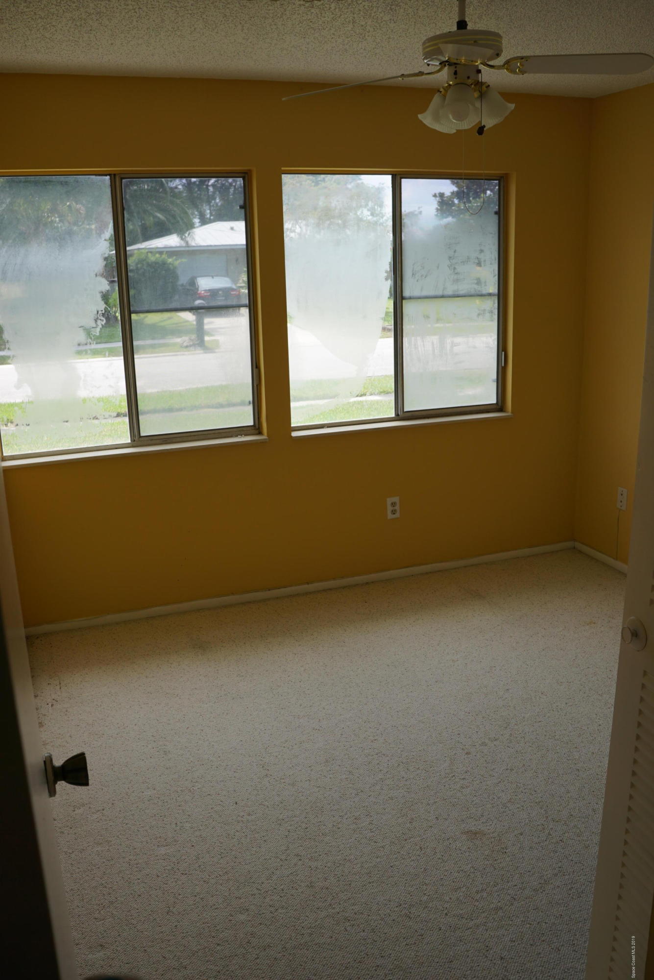 1167 Cotton Road Northeast Palm Bay, FL 32905 - Photo 26 of 34 a view of a room that has a window in it