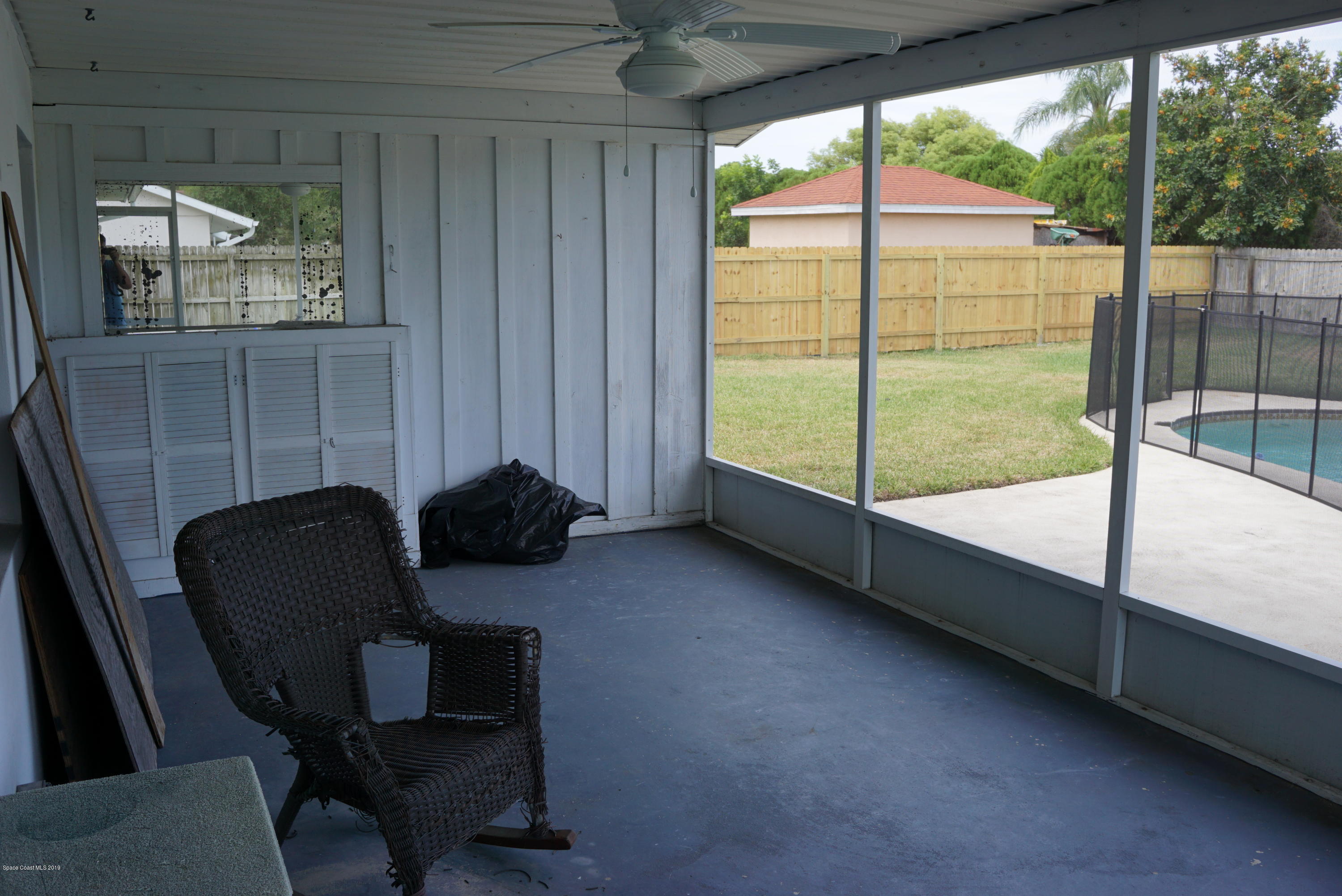 1167 Cotton Road Northeast Palm Bay, FL 32905 - Photo 27 of 34 a reading room with furniture and a garden view