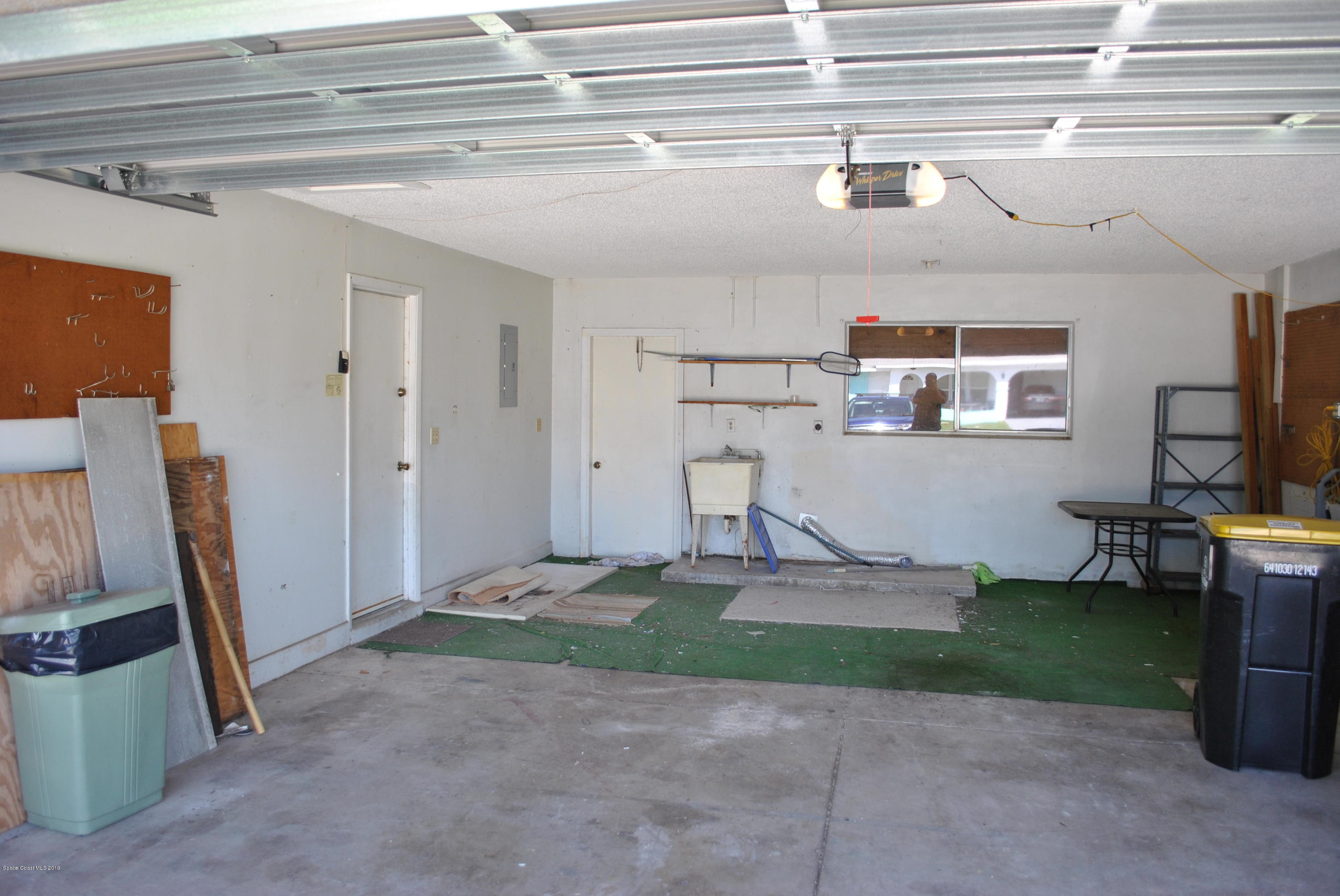1167 Cotton Road Northeast Palm Bay, FL 32905 - Photo 29 of 34 a view of a livingroom with storage & utility room