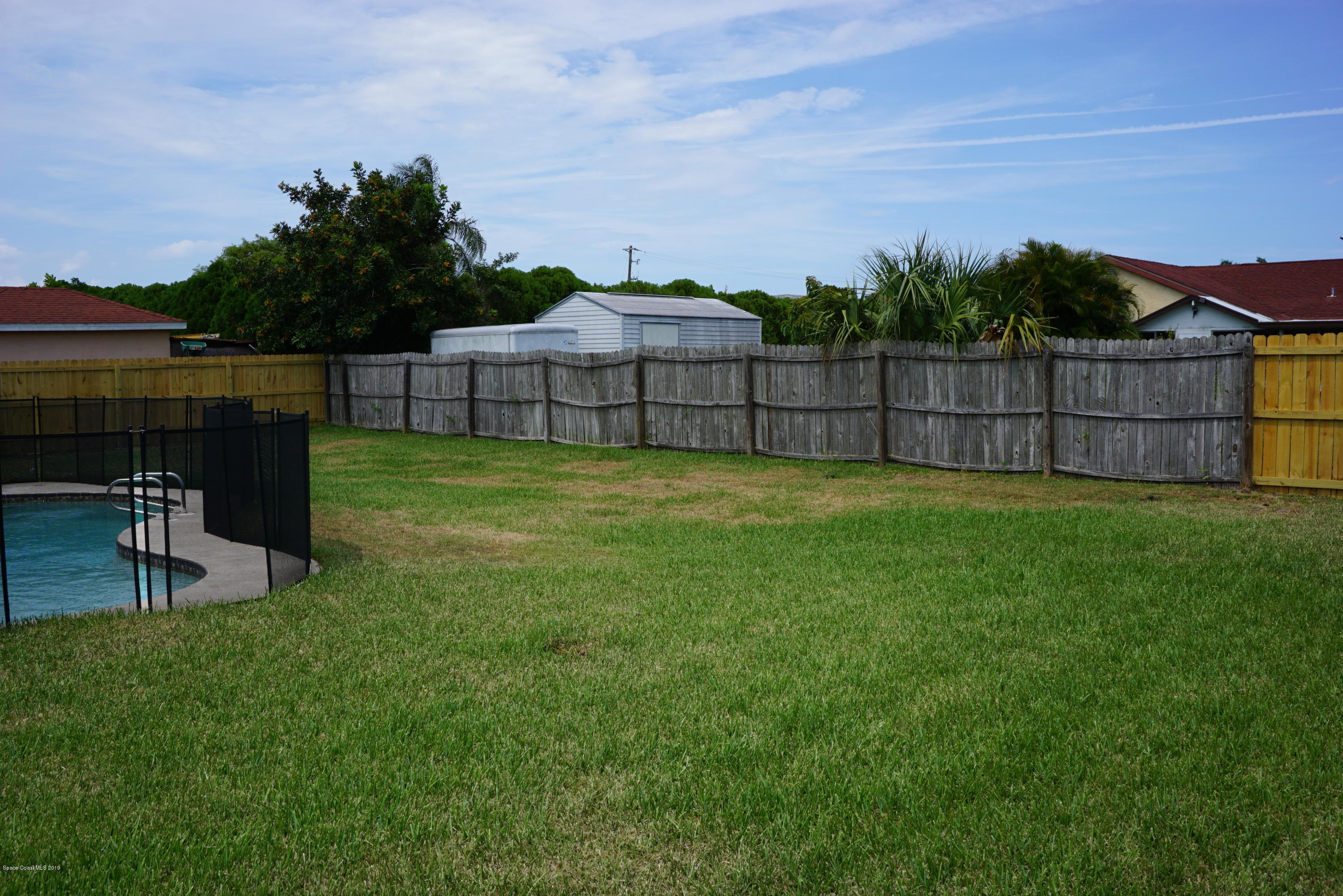 1167 Cotton Road Northeast Palm Bay, FL 32905 - Photo 32 of 34 a view of a backyard