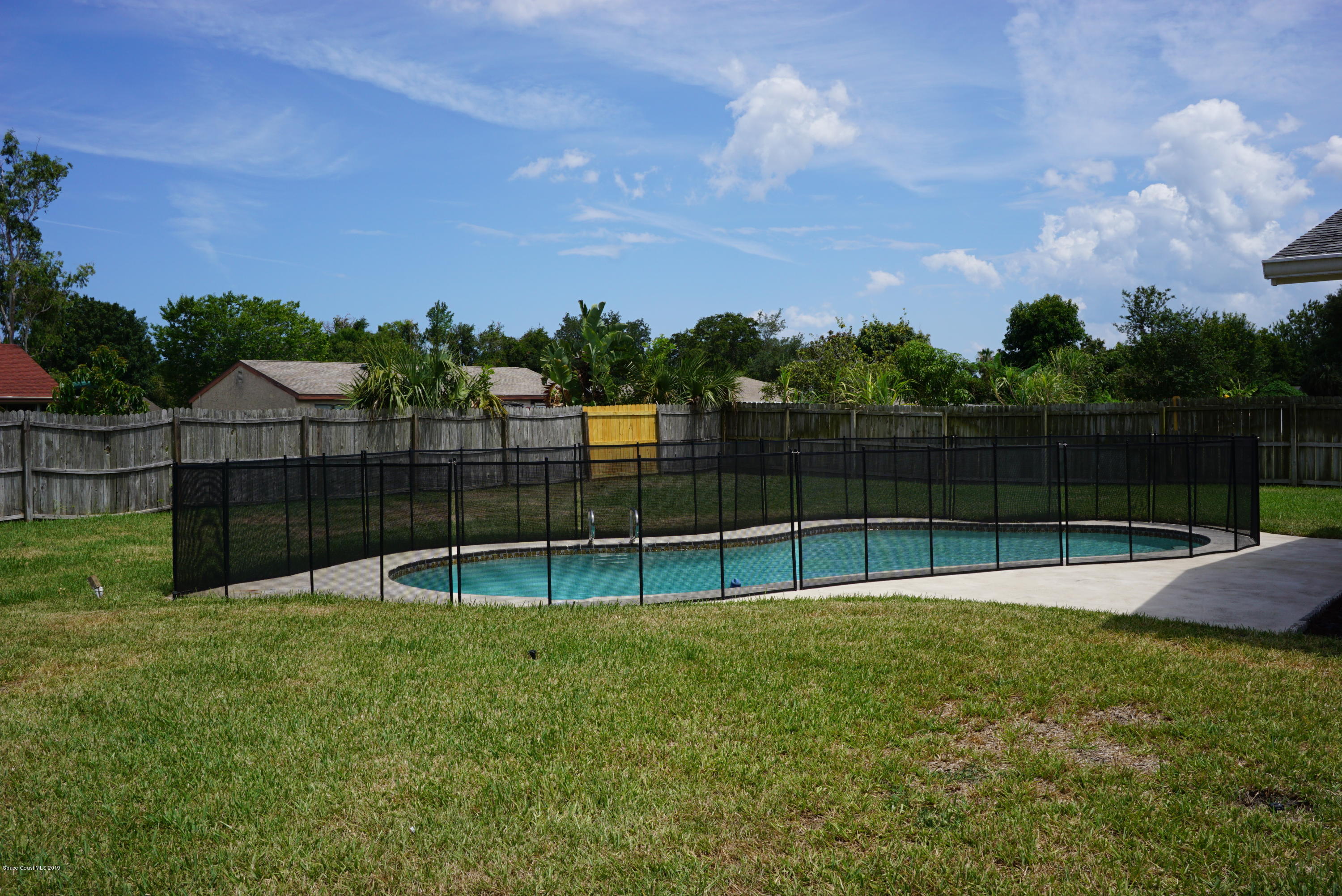 1167 Cotton Road Northeast Palm Bay, FL 32905 - Photo 34 of 34 a view of a backyard with a small park