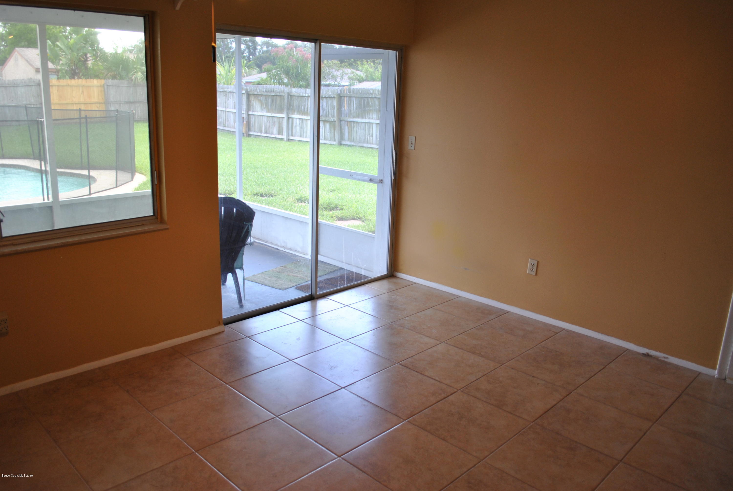 1167 Cotton Road Northeast Palm Bay, FL 32905 - Photo 8 of 34 a view of a room with a large window