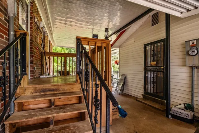a room with furniture a rug toys and wooden floor