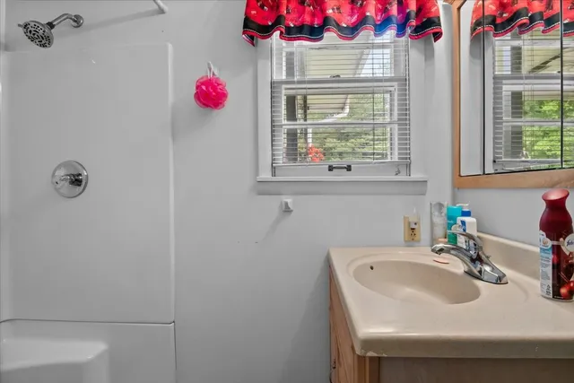 a front view of a house with a yard table and chairs