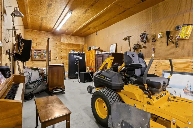a view of patio with a table and chairs under an umbrella