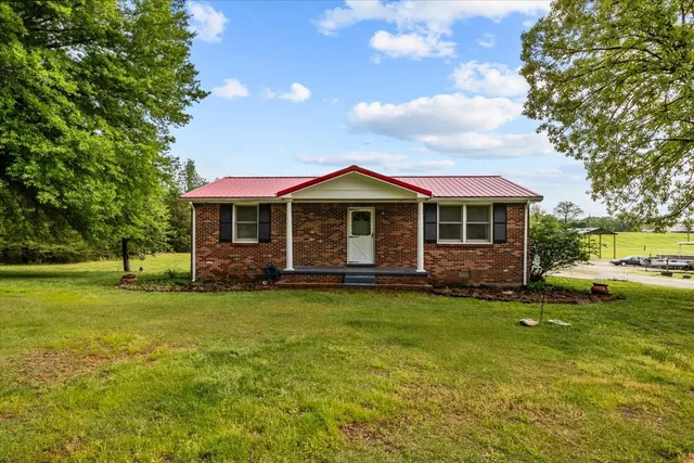 a view of a house with a big yard