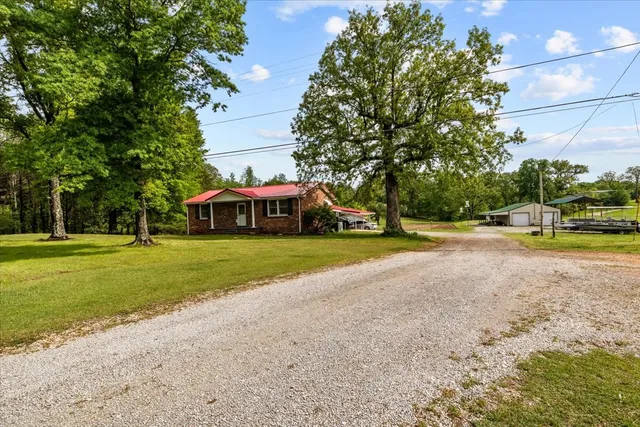 an aerial view of a house with outdoor space