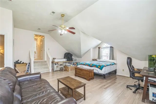 a living room with furniture fireplace and window