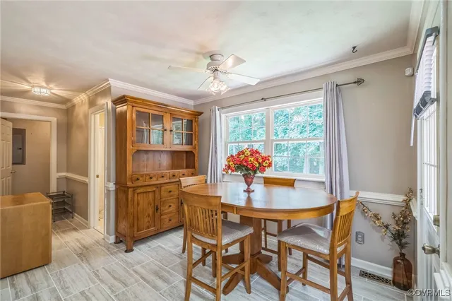 a dining room with furniture and window
