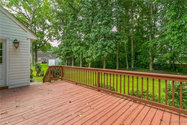 a view of deck with a large trees