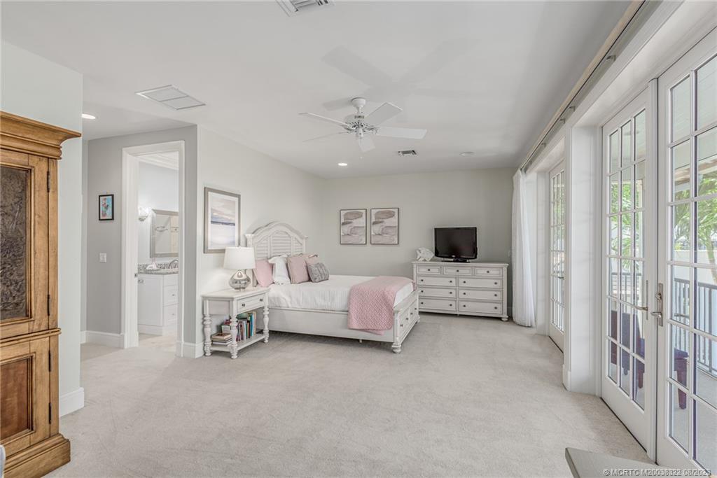 1455 Southeast Riverside Drive Stuart, FL 34996 - Photo 88 of 100 a living room with furniture and a flat screen tv