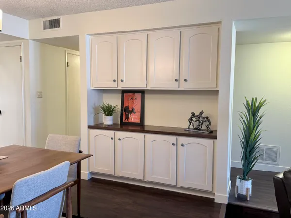 a dining room with wooden floor and breakfast area