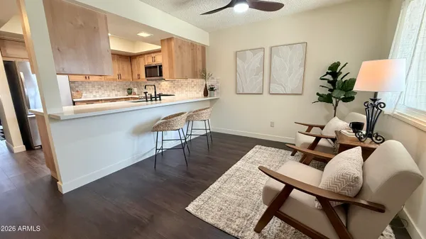 a kitchen with stainless steel appliances white cabinets white stove a refrigerator and a microwave