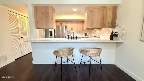 a view of a hallway with furniture and window
