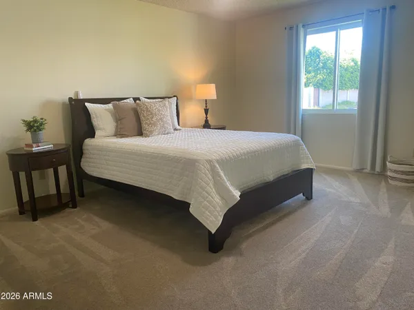 a view of a workspace room with furniture and wooden floor