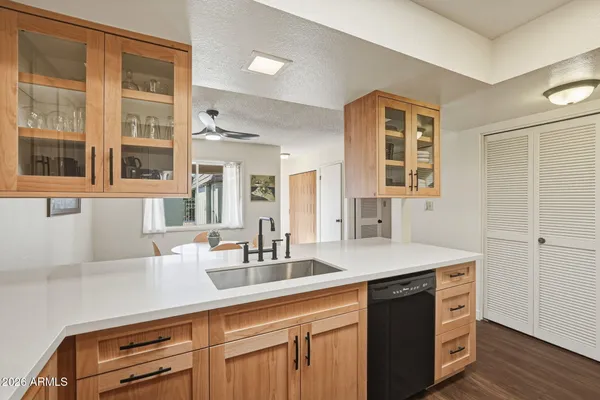 a kitchen with stainless steel appliances white cabinets white stove a refrigerator and a microwave