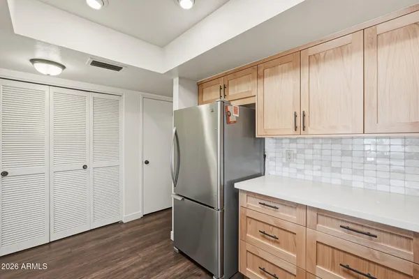 a kitchen with a sink and cabinets