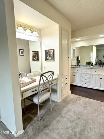 a view of a hallway with furniture and window