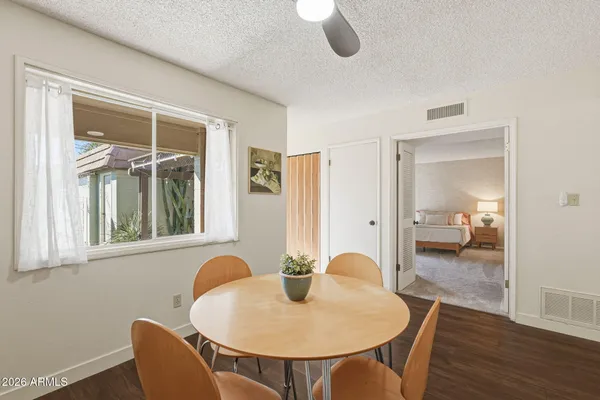 a view of a dining room with furniture and wooden floor