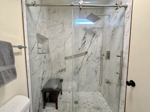 a bathroom with double vanity sink and a mirror