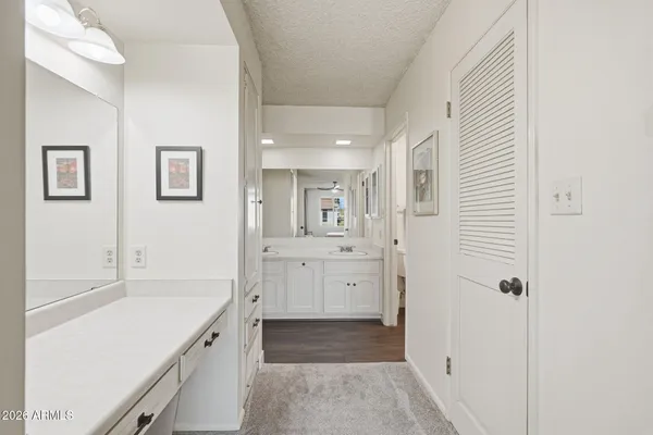 a bathroom with a tub sink and mirror