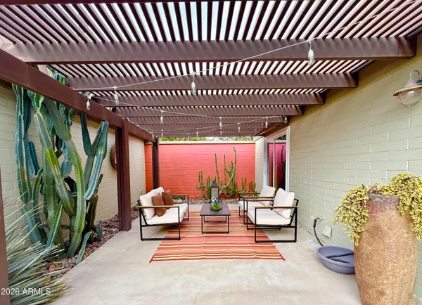 a vase of flowers sitting on a granite counter